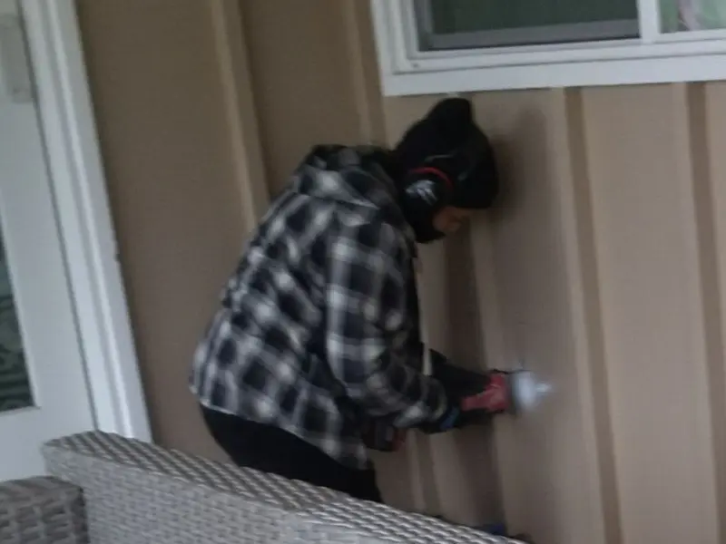 Professional electrician installing an exterior outlet in Mountainside